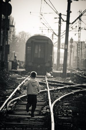 kid running after train